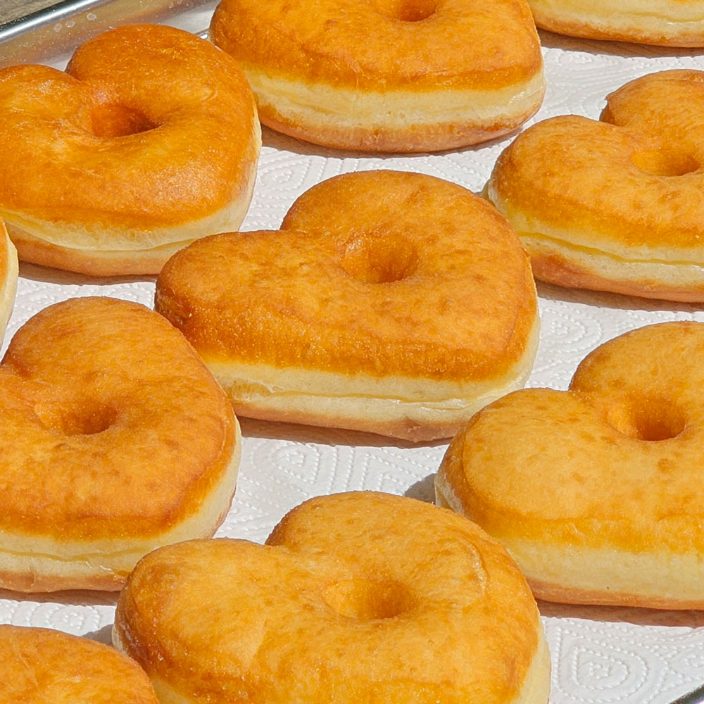 Golden fried heart donuts, still plain