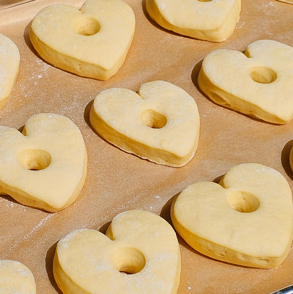 Risen pale heart dough resting on parchment
