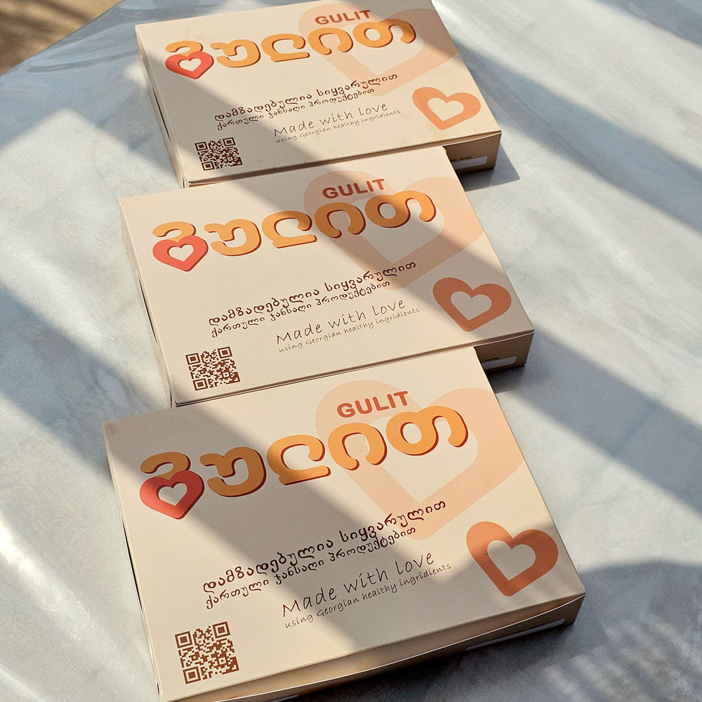 Three cream Gulit boxes