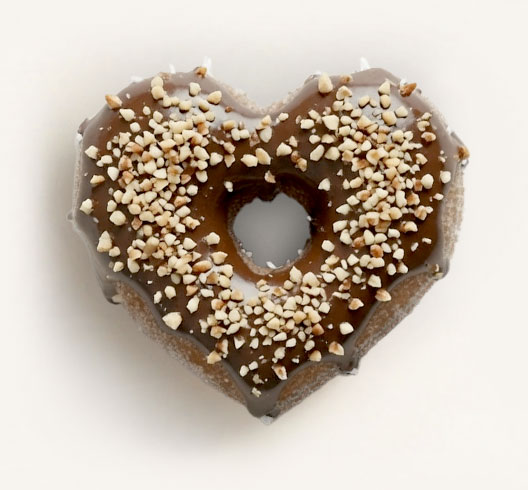 Chocolate with almond pieces heart donut